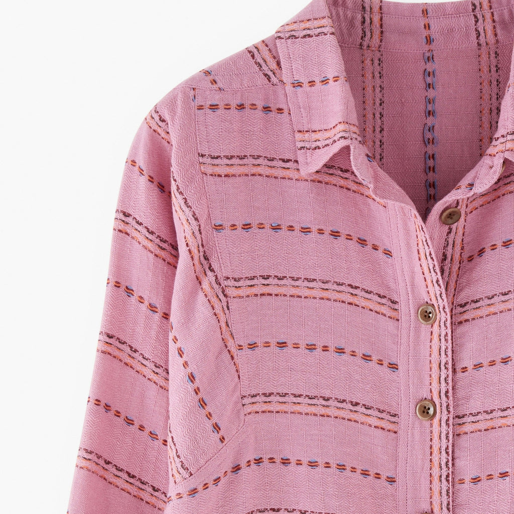 Pink striped shirt with buttons on a white background